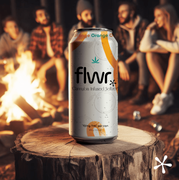 An example of Stephany's work. Flwr is a cannabis infused seltzer. A can of Flwr sits on a log. In the background is a group of people sitting around a few. 